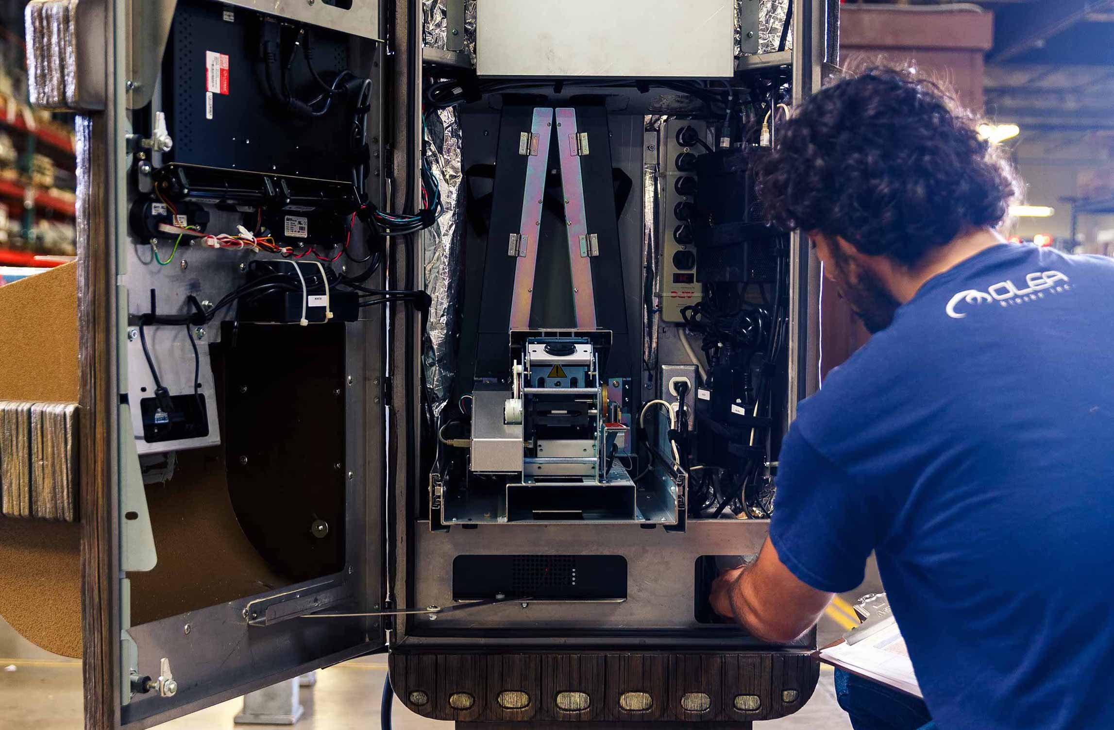 Olea Employee Fixing a Kiosk