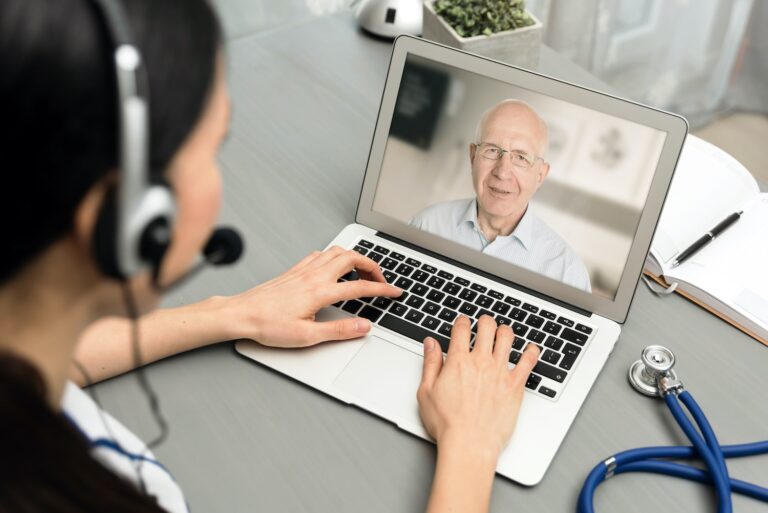 Doctor talking with a senior patient online