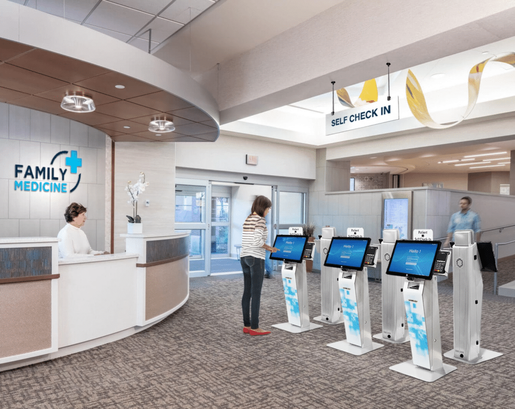 Woman Using Self Check-in Kiosk at Family Medicine